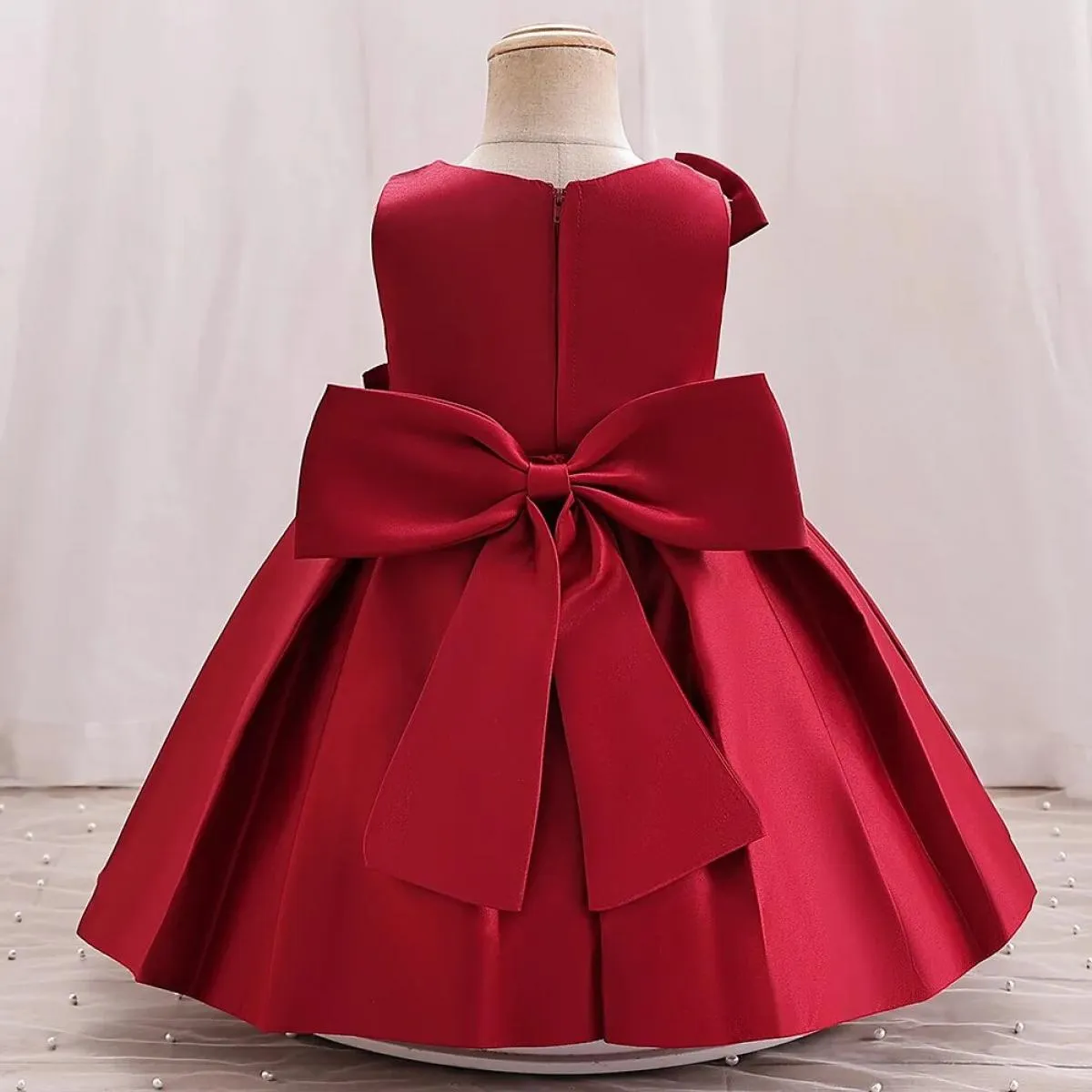 2023 Abito da ragazza di fiori da sposa per bambini Abito in raso con grande fiocco Il primo abito da banchetto di Natale adatto