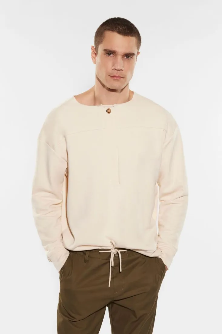 Felpa oversize monocolour con cuciture dettaglio e bottone