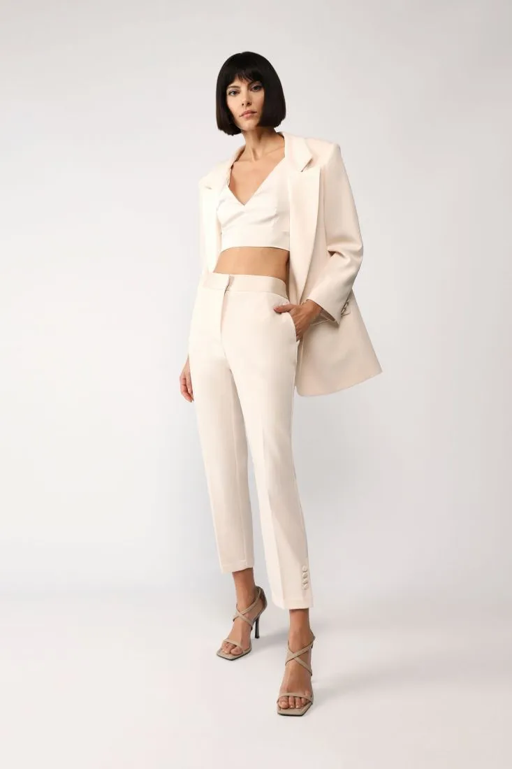 Pantaloni cropped straight monocolour con piega stirata