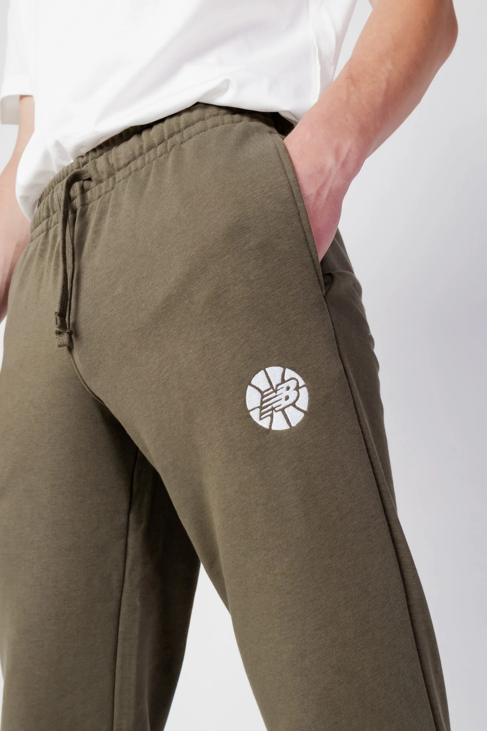 Pantaloni sportivi New Balance hoops essentials fundamental Verde Oliva
